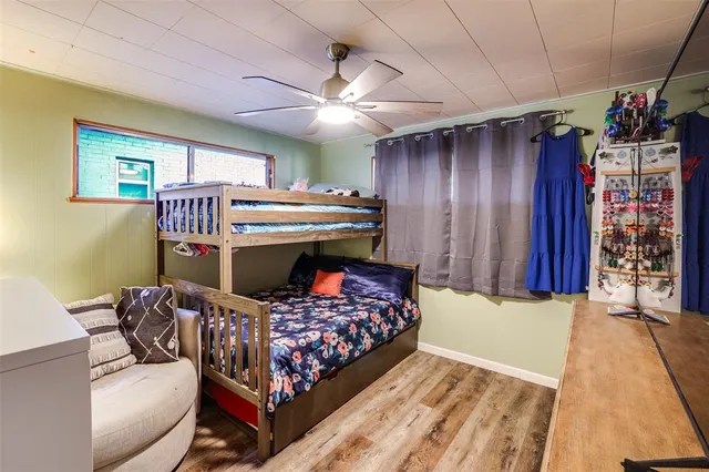 a bed room with a bed and a chair