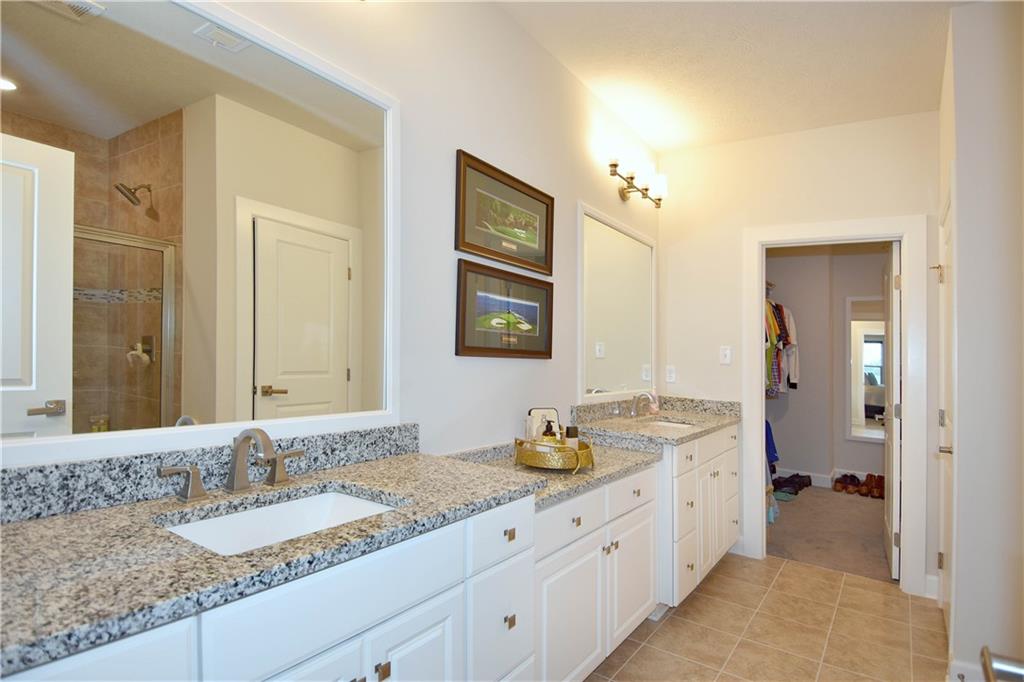 4103 Spruce Road Gibsonia, PA 15044 - Photo 13 of 25 a bathroom with a granite countertop double vanity sink and a mirror