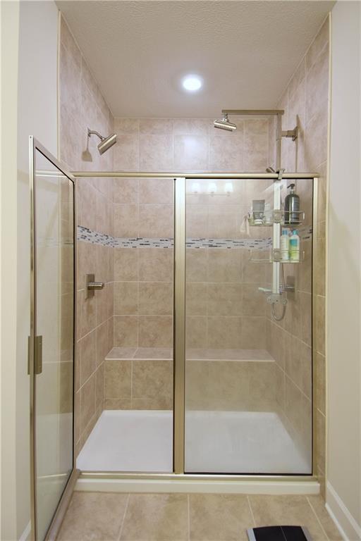 4103 Spruce Road Gibsonia, PA 15044 - Photo 14 of 25 a bathroom with a glass shower door