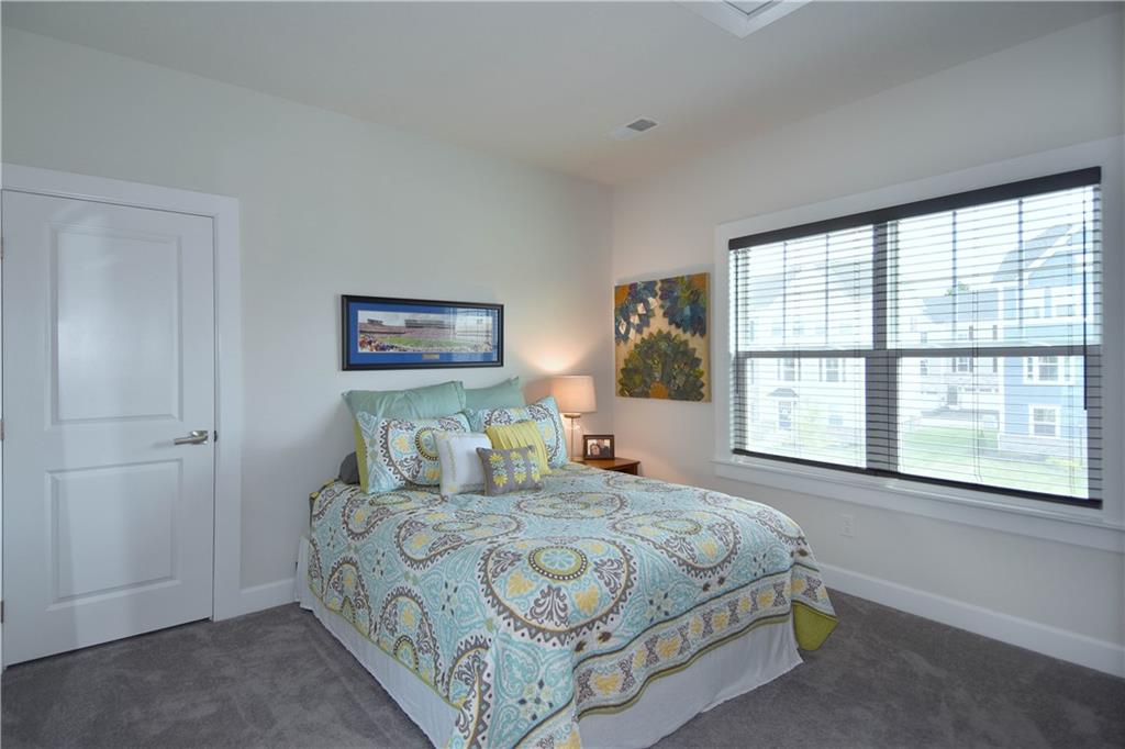4103 Spruce Road Gibsonia, PA 15044 - Photo 15 of 25 a bedroom with a large bed and a large window