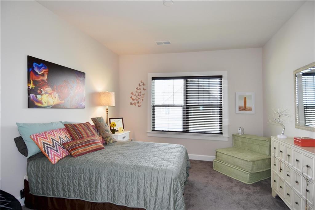 4103 Spruce Road Gibsonia, PA 15044 - Photo 16 of 25 a bedroom with a bed and a couch
