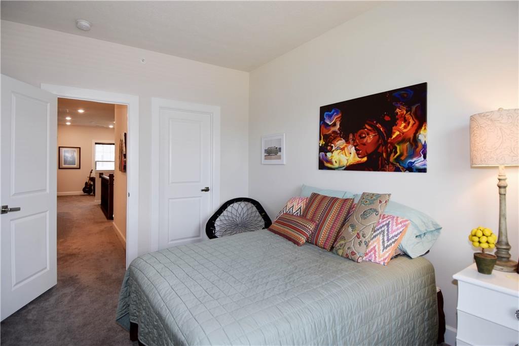 4103 Spruce Road Gibsonia, PA 15044 - Photo 17 of 25 a bedroom with a bed and a painting on the wall