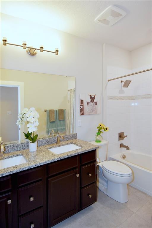 4103 Spruce Road Gibsonia, PA 15044 - Photo 18 of 25 a bathroom with a granite countertop bathtub sink vanity mirror and toilet