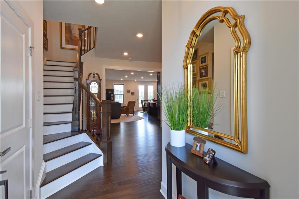 4103 Spruce Road Gibsonia, PA 15044 - Photo 2 of 25 a view of a hallway with wooden floor and staircase