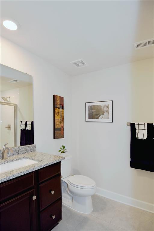 4103 Spruce Road Gibsonia, PA 15044 - Photo 22 of 25 a bathroom with a toilet a sink and mirror