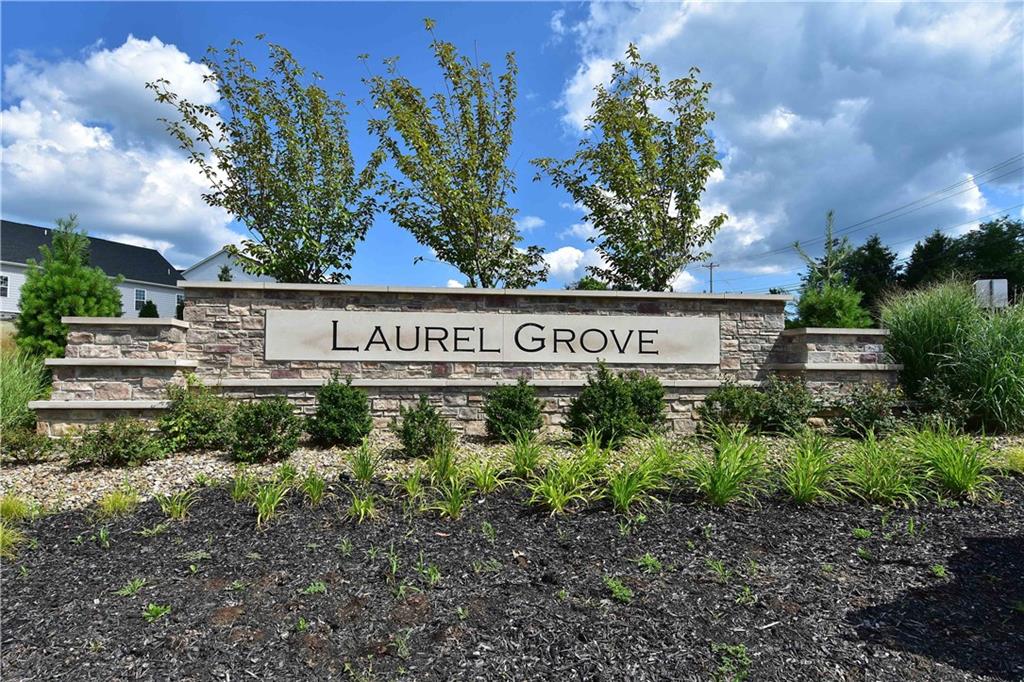 4103 Spruce Road Gibsonia, PA 15044 - Photo 25 of 25 a sign that is sitting in front of flowers