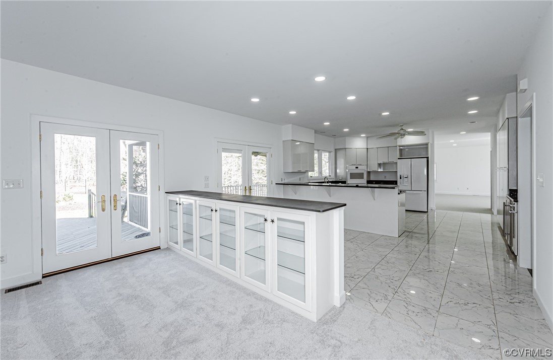 13510 Stonegate Road Midlothian, VA 23113 - Photo 16 of 50 a open kitchen with white cabinets and stainless steel appliances
