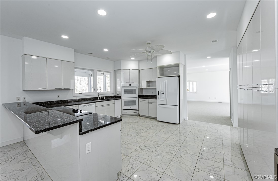 13510 Stonegate Road Midlothian, VA 23113 - Photo 17 of 50 a kitchen with stainless steel appliances granite countertop a refrigerator and a stove