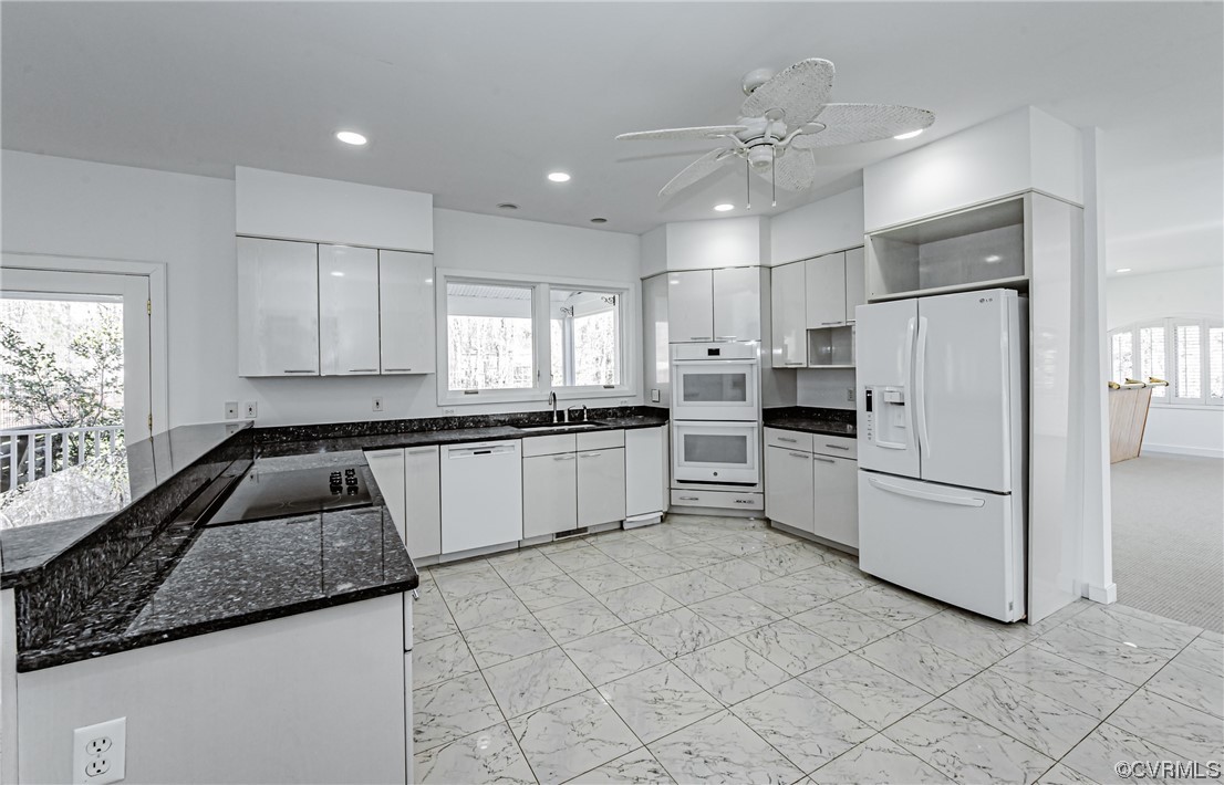 13510 Stonegate Road Midlothian, VA 23113 - Photo 19 of 50 a kitchen with granite countertop white cabinets and white stainless steel appliances