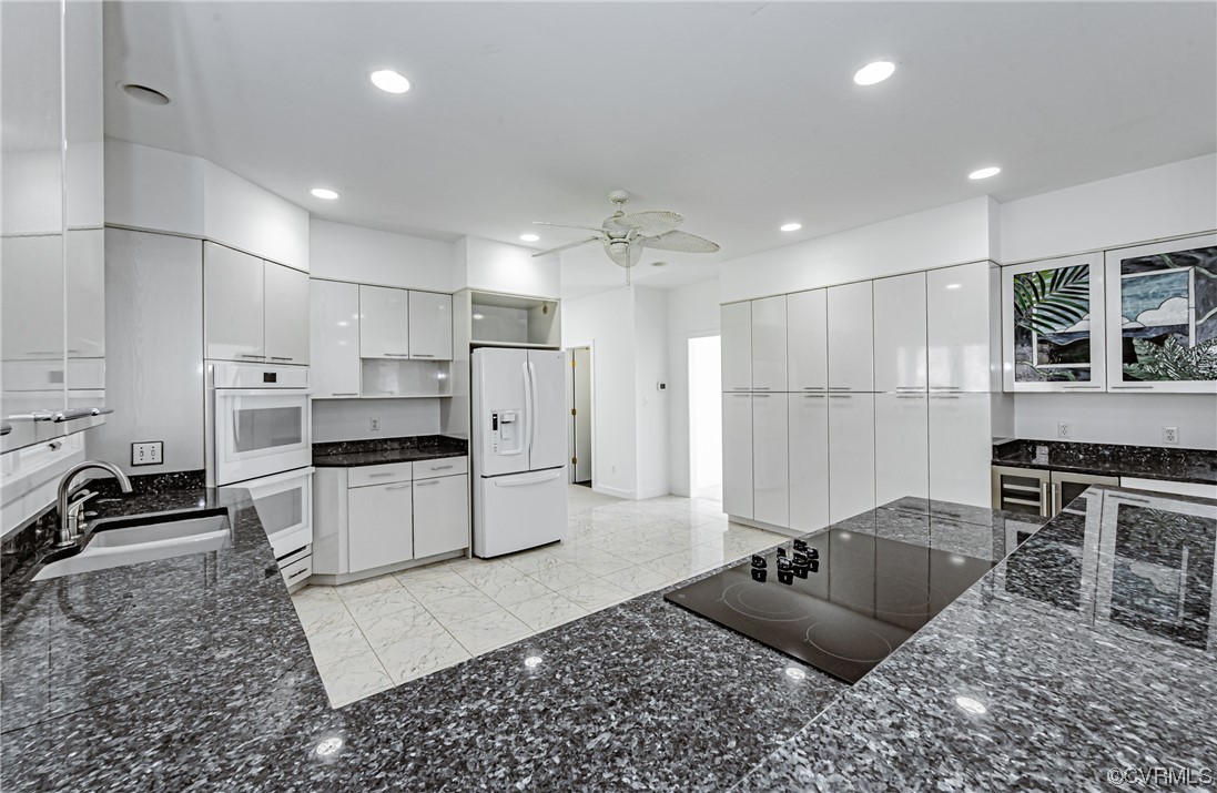 13510 Stonegate Road Midlothian, VA 23113 - Photo 20 of 50 a kitchen with stainless steel appliances kitchen island granite countertop a refrigerator and a stove top oven