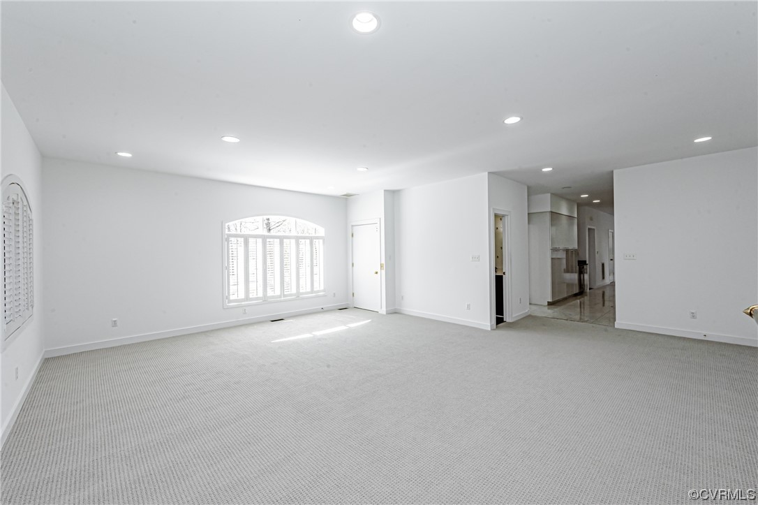 13510 Stonegate Road Midlothian, VA 23113 - Photo 22 of 50 an empty room with a window and a refrigerator
