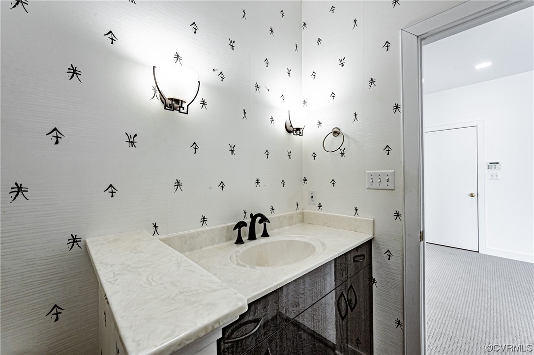 13510 Stonegate Road Midlothian, VA 23113 - Photo 27 of 50 a bathroom with a sink and a mirror