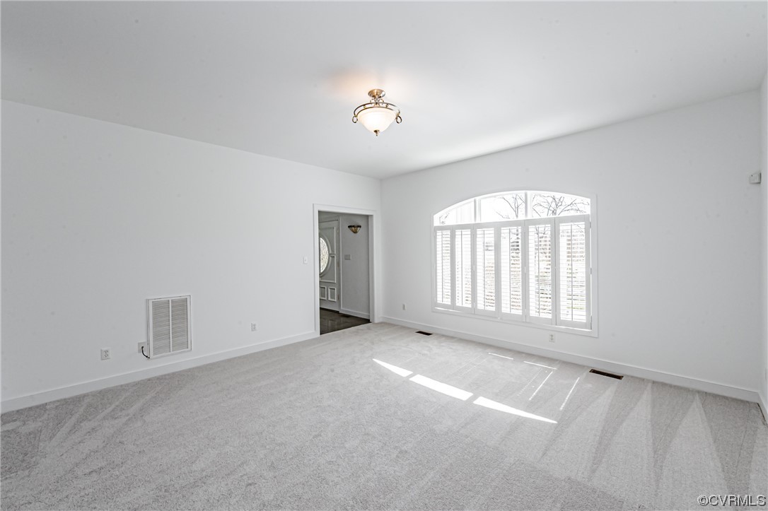 13510 Stonegate Road Midlothian, VA 23113 - Photo 29 of 50 an empty room with windows and ceiling fan