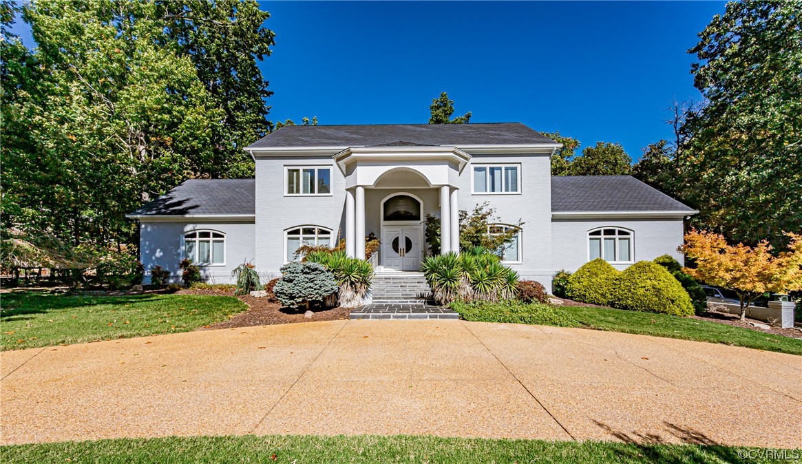 13510 Stonegate Road Midlothian, VA 23113 - Photo 3 of 50 a front view of a house with a garden