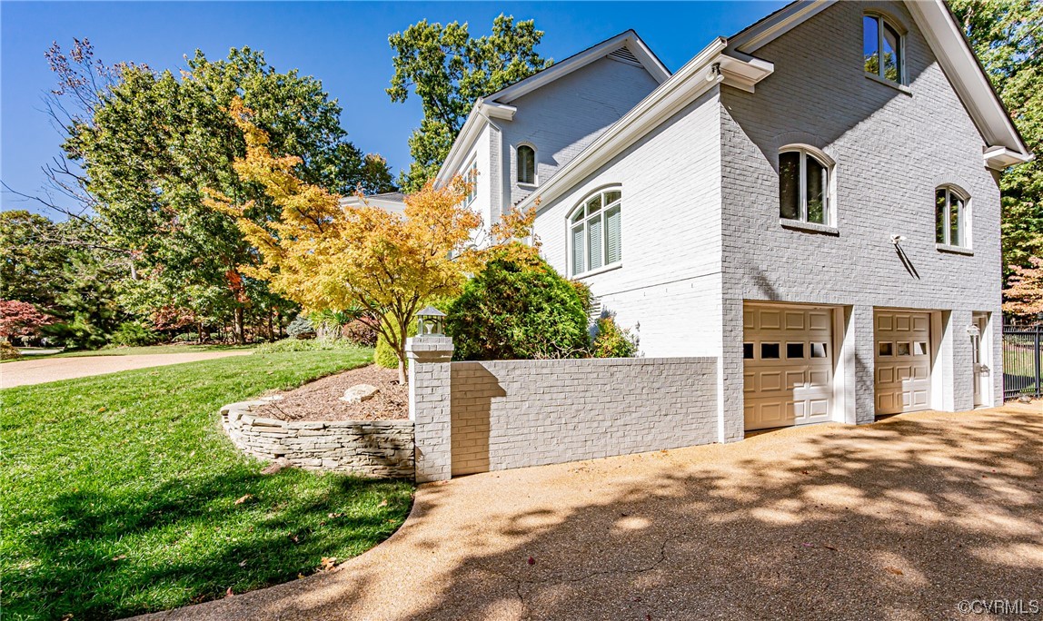 13510 Stonegate Road Midlothian, VA 23113 - Photo 4 of 50 a front view of a house with garden