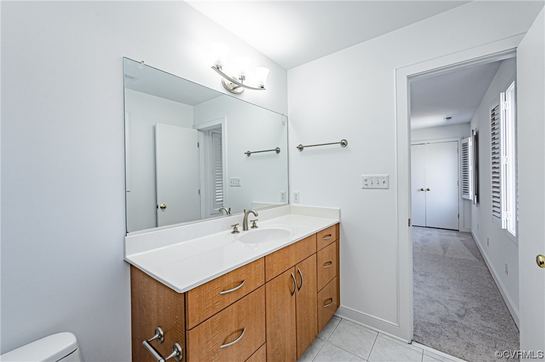 13510 Stonegate Road Midlothian, VA 23113 - Photo 41 of 50 a bathroom with a sink a toilet and shower