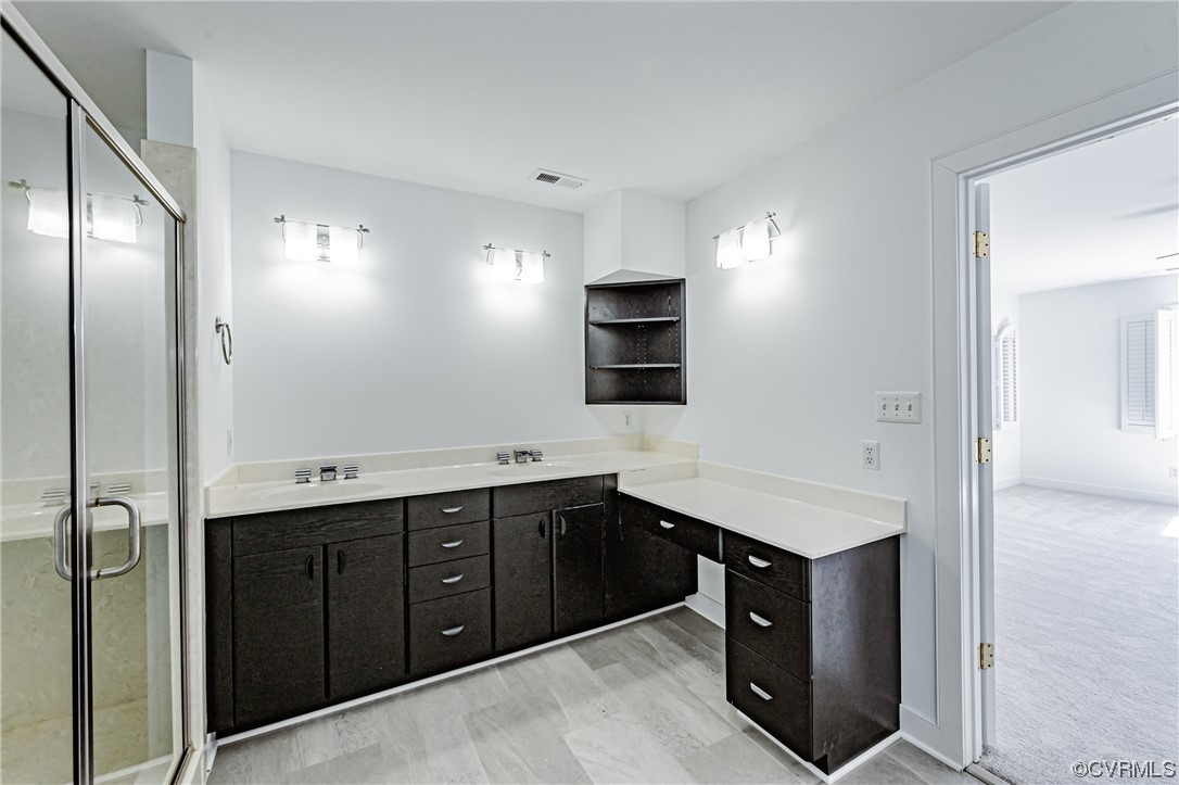 13510 Stonegate Road Midlothian, VA 23113 - Photo 47 of 50 a kitchen with a sink and a stove top oven with wooden floor