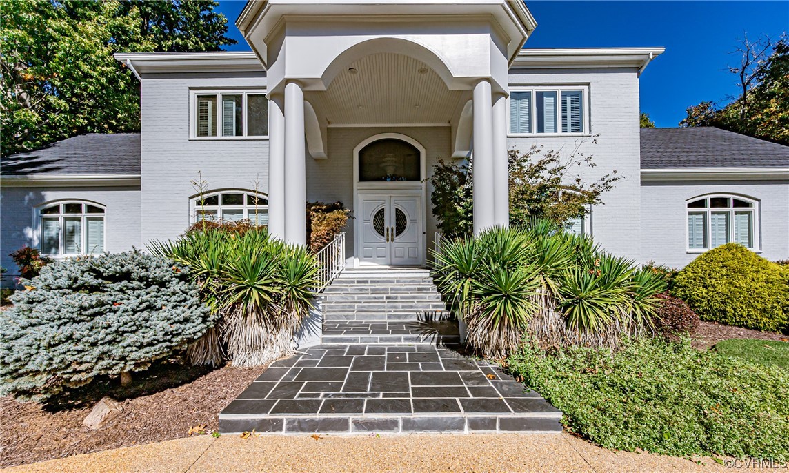 13510 Stonegate Road Midlothian, VA 23113 - Photo 9 of 50 a front view of a house with a garden