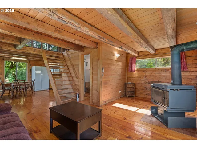 a view of a living room and a wooden floor