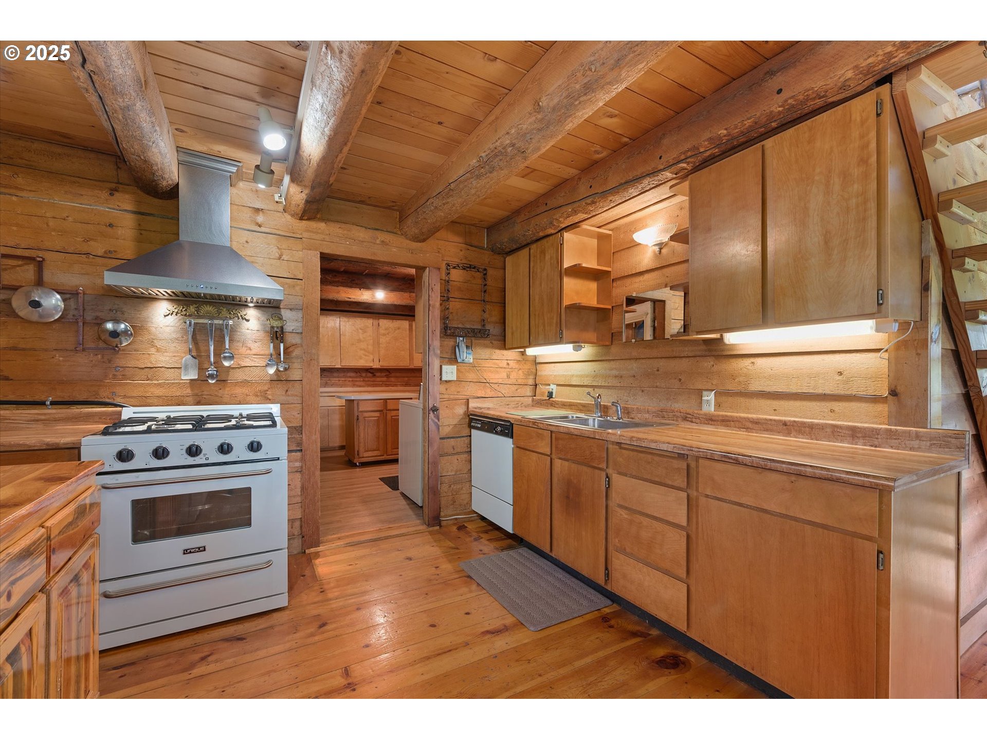 35912 Valley View Lane Halfway, OR 97834 - Photo 19 of 43 a kitchen with stainless steel appliances granite countertop a stove a sink and a microwave