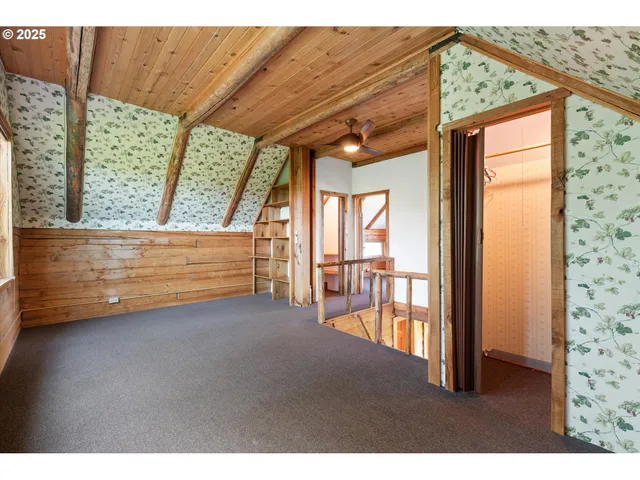 a view of room with window and wooden floor