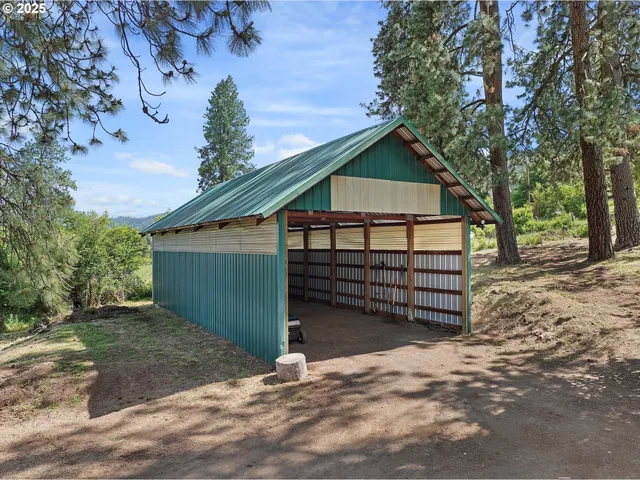 a view of a room with lots of furniture and windows