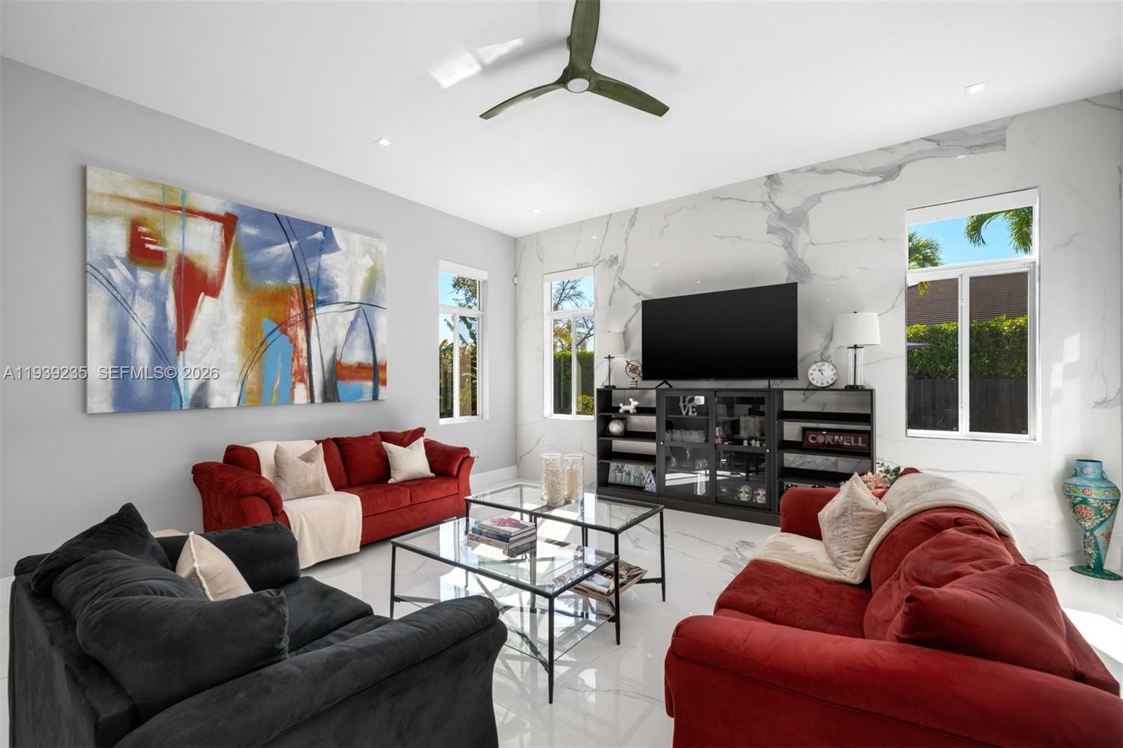 10250 Southwest 135th Street Miami, FL 33176 - Photo 12 of 35 a living room with furniture and a flat screen tv