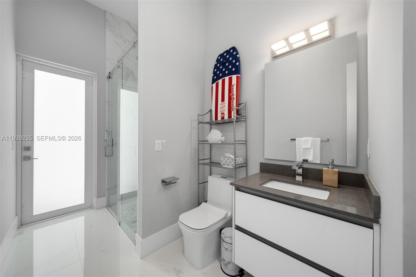 10250 Southwest 135th Street Miami, FL 33176 - Photo 13 of 35 a bathroom with a sink a toilet and shower