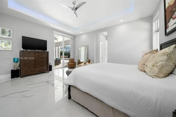 a large bathroom with a bathtub and shower