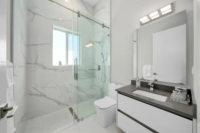 a bathroom with double sink and a mirror