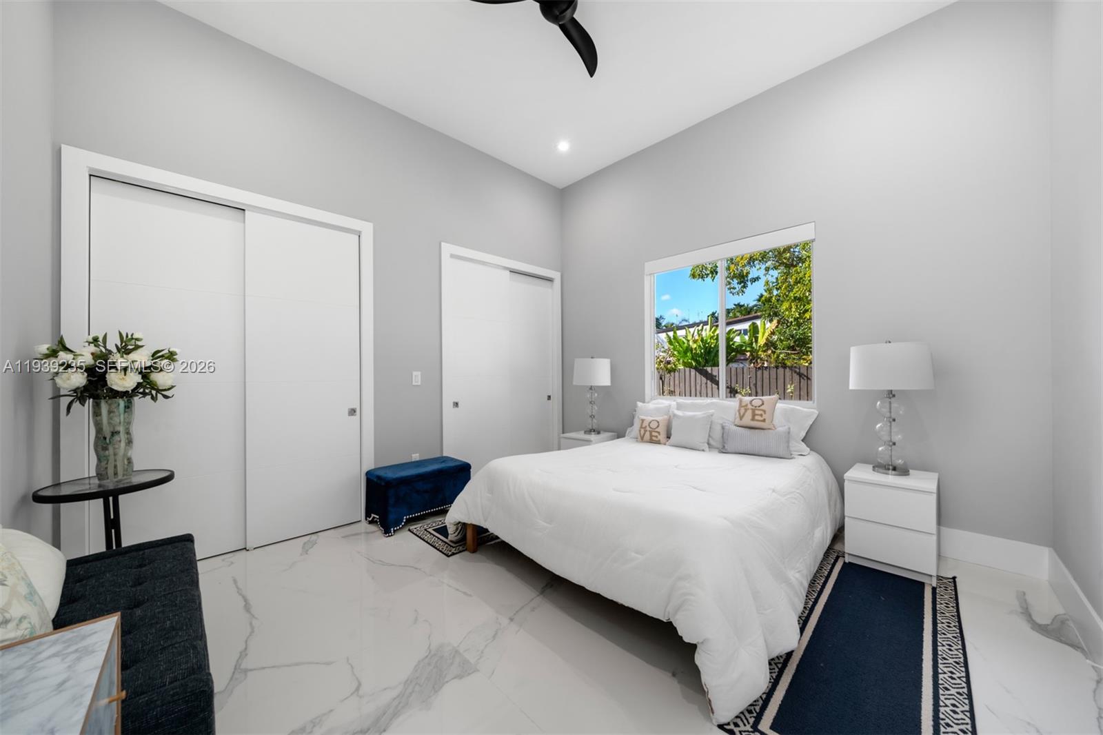 10250 Southwest 135th Street Miami, FL 33176 - Photo 20 of 35 a bedroom with a bed and a chandelier