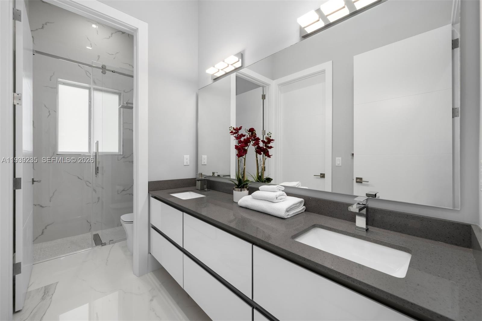 10250 Southwest 135th Street Miami, FL 33176 - Photo 21 of 35 a bathroom with double sink and a mirror