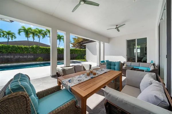 a view of a yard with flower plants