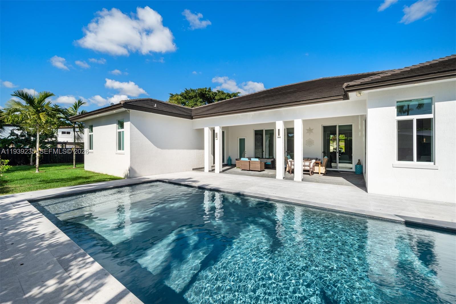 10250 Southwest 135th Street Miami, FL 33176 - Photo 27 of 35 a view of a house with backyard and sitting area