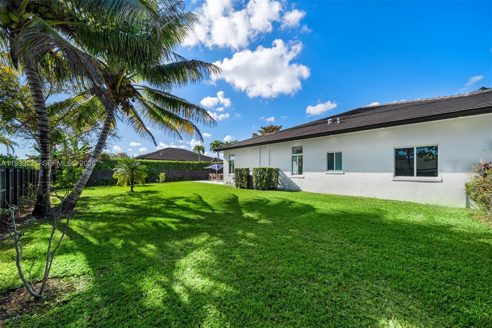10250 Southwest 135th Street Miami, FL 33176 - Photo 29 of 35 a front view of house with yard and green space