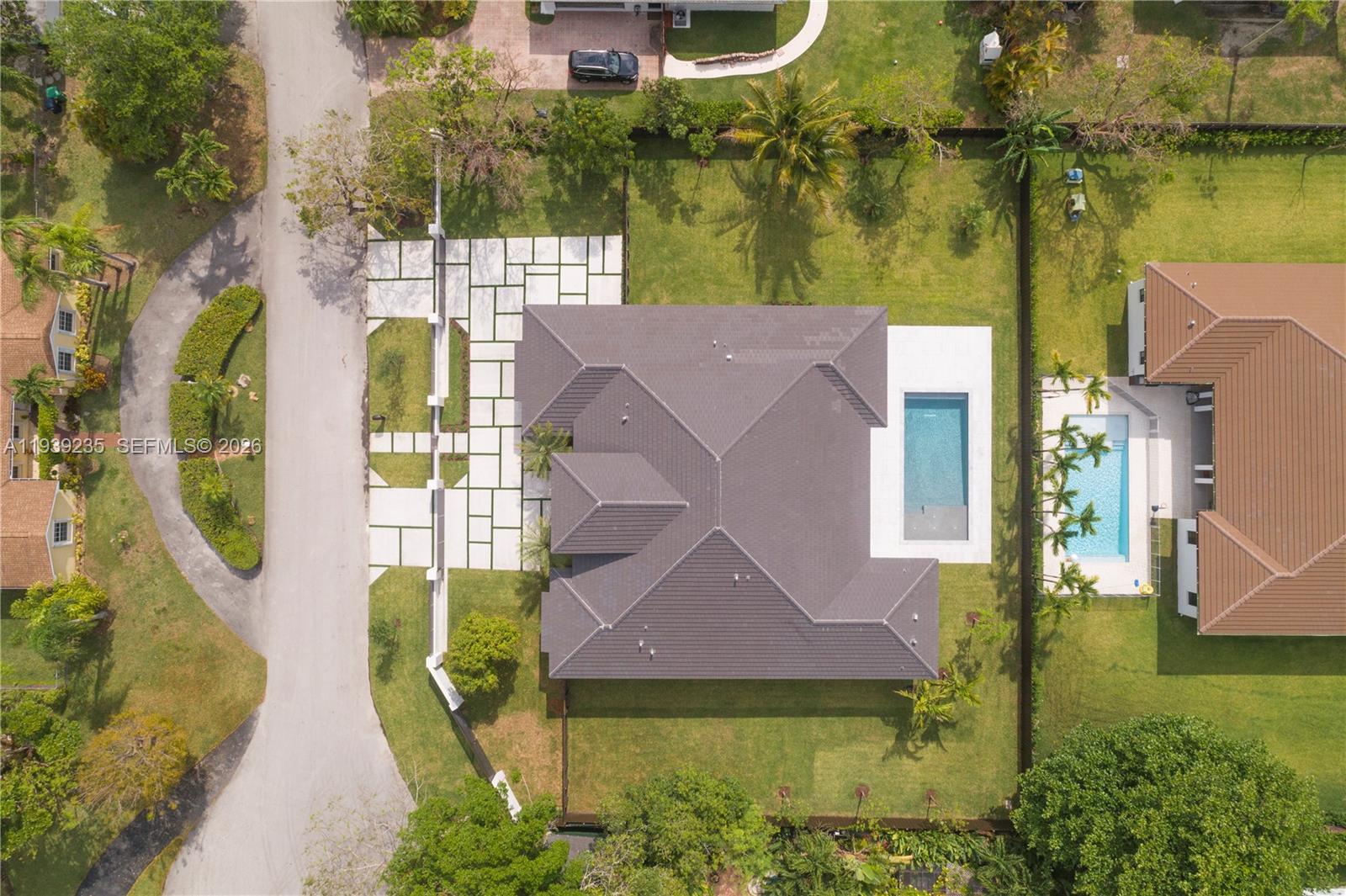 10250 Southwest 135th Street Miami, FL 33176 - Photo 34 of 35 an aerial view of a house with a garden and swimming pool