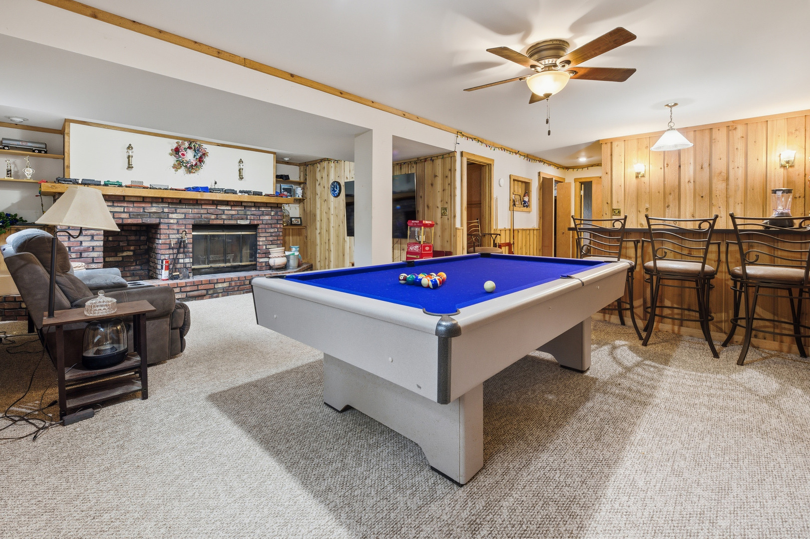 550 Norman Drive Cary, IL 60013 - Photo 14 of 20 a living room with furniture a flat screen tv and a fireplace