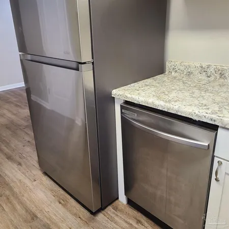 a view of a refrigerator in kitchen