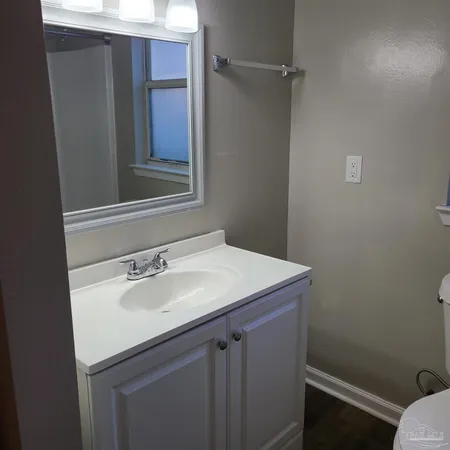 a bathroom with a sink and vanity