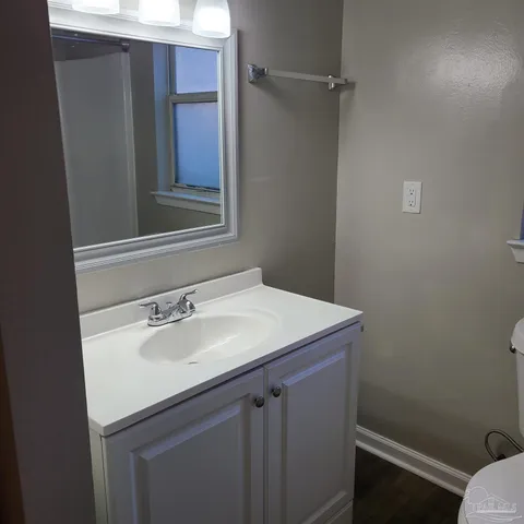 a bathroom with a sink and vanity