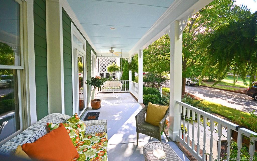 731 Julia Street Fort Mill, SC 29708 - Photo 2 of 20 a balcony with furniture and wooden floor