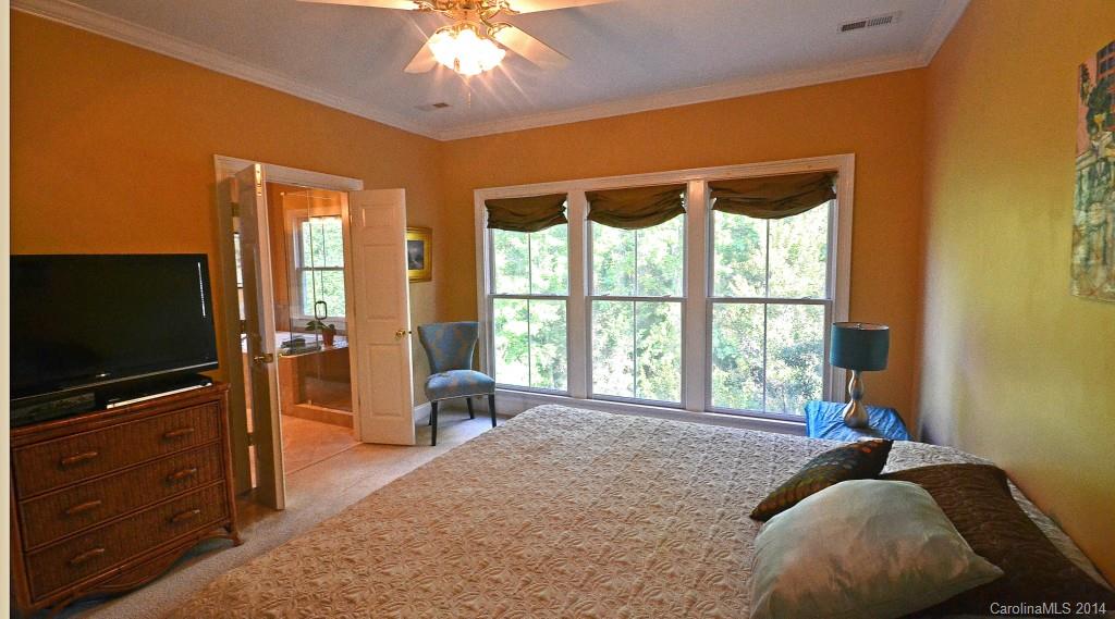 731 Julia Street Fort Mill, SC 29708 - Photo 12 of 20 a bedroom with a bed and a flat screen tv