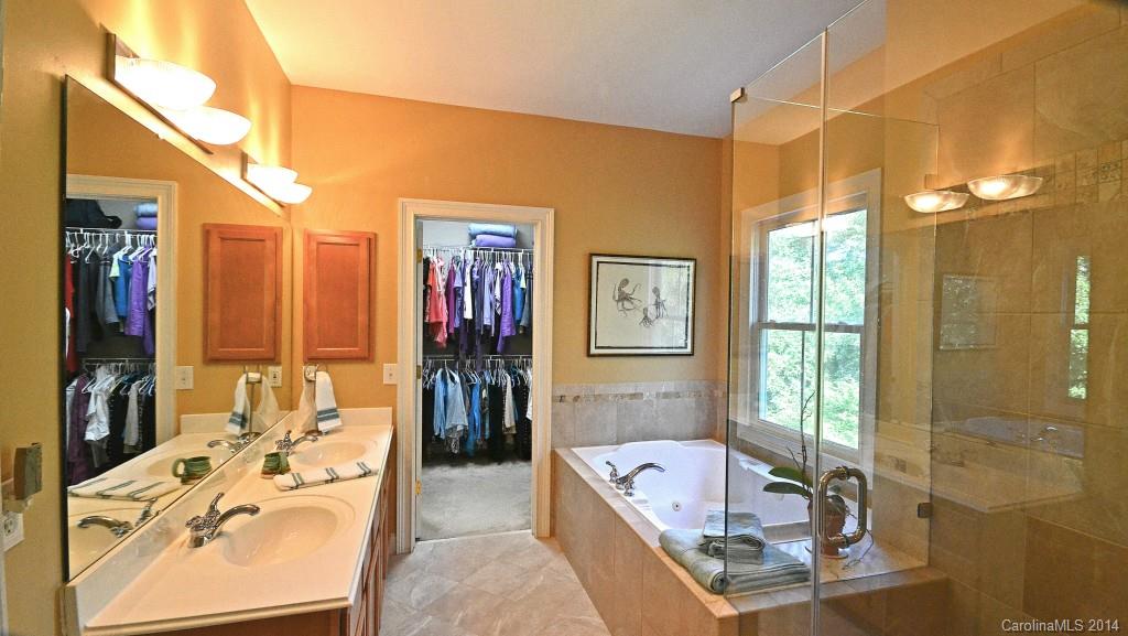 731 Julia Street Fort Mill, SC 29708 - Photo 13 of 20 a bathroom with a tub sink and glass door