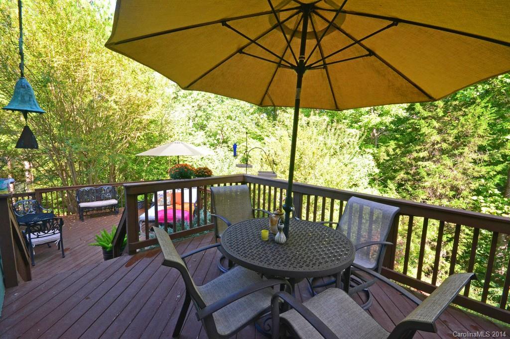 731 Julia Street Fort Mill, SC 29708 - Photo 17 of 20 a view of a deck with furniture and barbeque grill with wooden floor