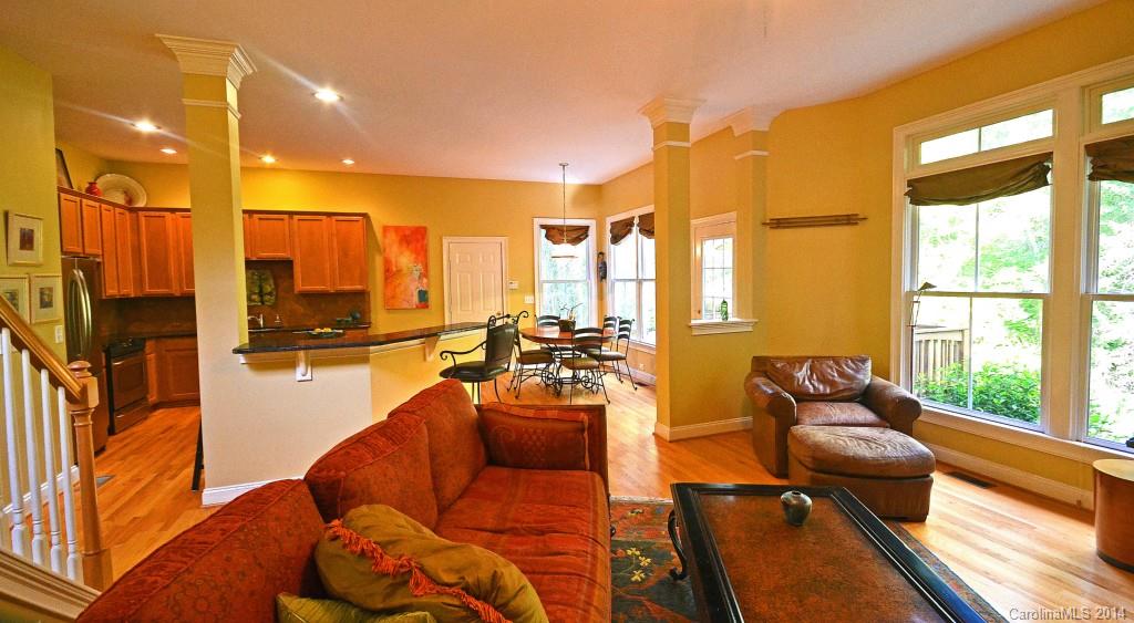 731 Julia Street Fort Mill, SC 29708 - Photo 6 of 20 a living room with furniture floor to ceiling window and a table