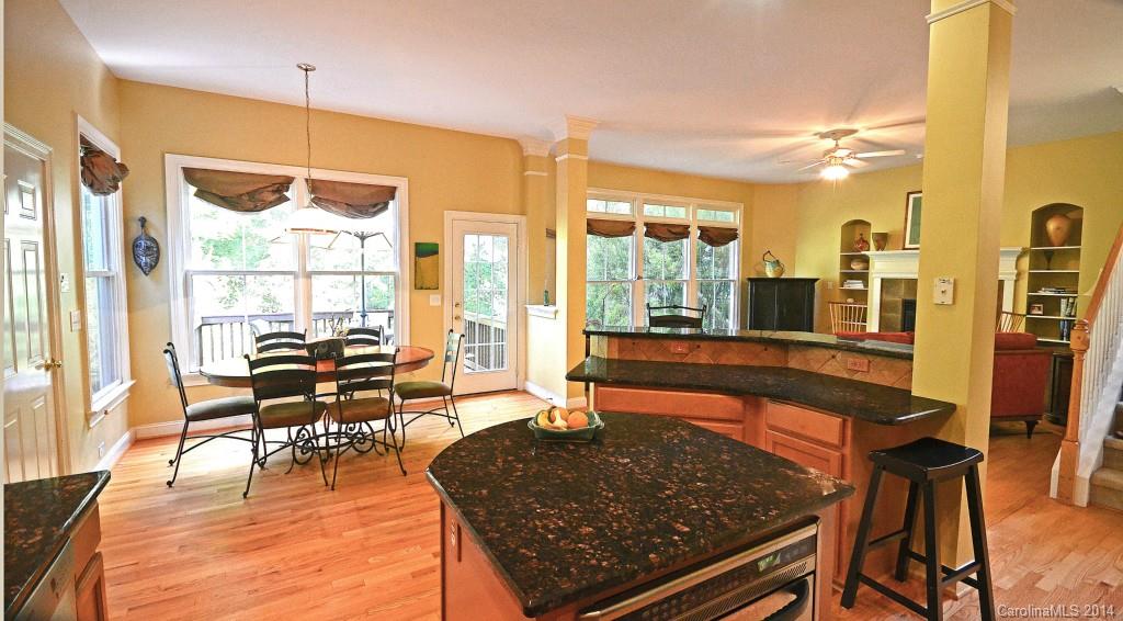 731 Julia Street Fort Mill, SC 29708 - Photo 7 of 20 a living room with couches a dining table and chairs with wooden floor