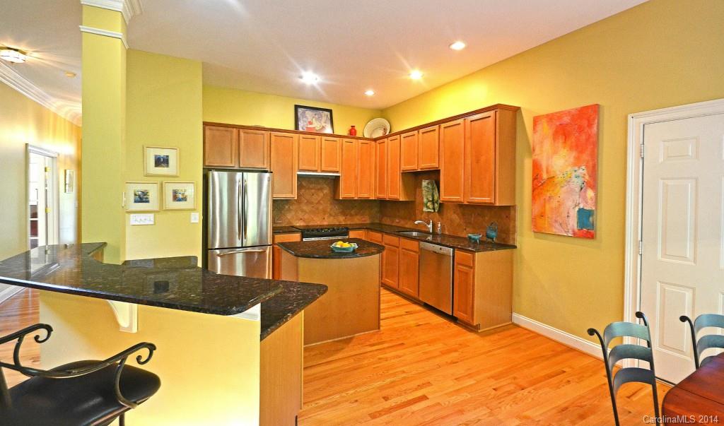 731 Julia Street Fort Mill, SC 29708 - Photo 8 of 20 a kitchen with stainless steel appliances granite countertop a stove a sink and a refrigerator
