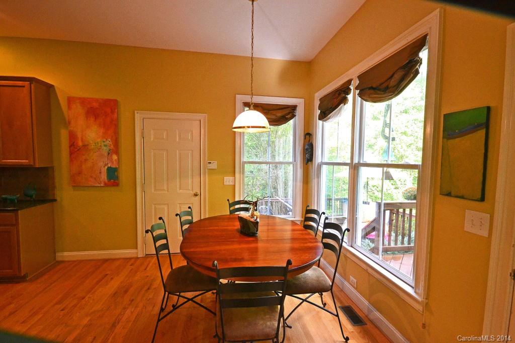 731 Julia Street Fort Mill, SC 29708 - Photo 9 of 20 a dining room with furniture a chandelier and wooden floor