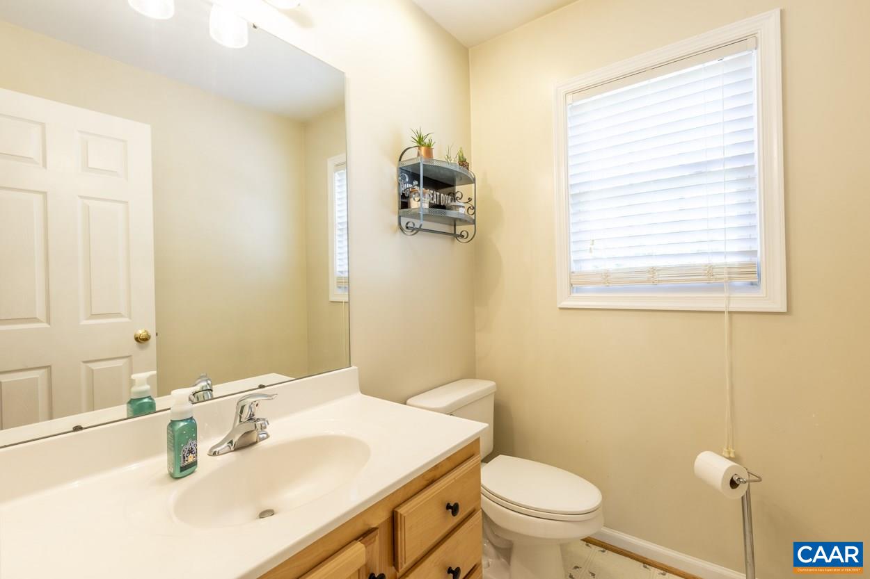 161 Jordan Store Road Kents Store, VA 23084 - Photo 20 of 50 a bathroom with a sink a toilet and a mirror