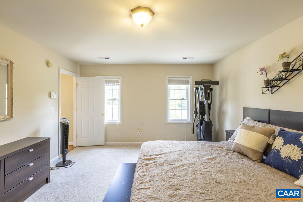 161 Jordan Store Road Kents Store, VA 23084 - Photo 25 of 50 a bedroom with a bed and a window